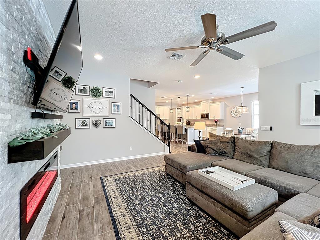 2676 Estuary Loop Oviedo, FL 32765 - Photo 33 of 92 a living room with furniture and a flat screen tv