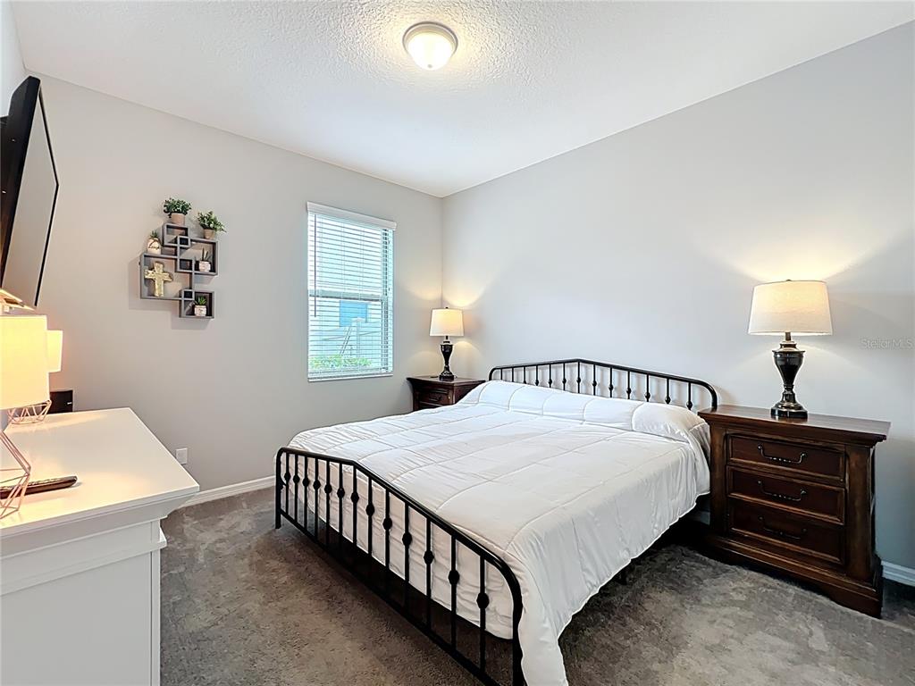 2676 Estuary Loop Oviedo, FL 32765 - Photo 35 of 92 a bedroom with a bed and a window