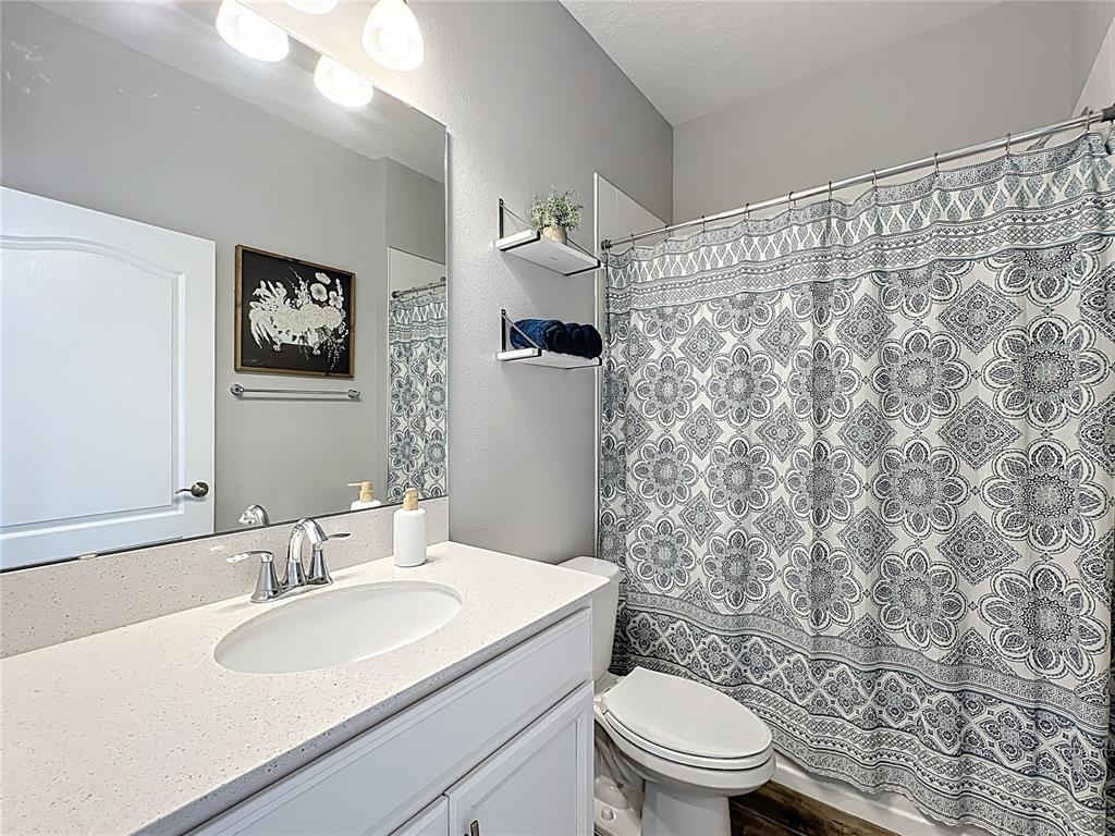 2676 Estuary Loop Oviedo, FL 32765 - Photo 36 of 92 a bathroom with a sink toilet and a mirror