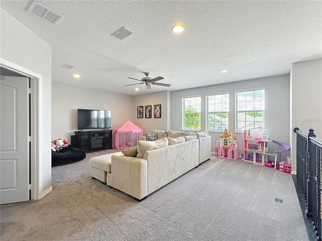 2676 Estuary Loop Oviedo, FL 32765 - Photo 44 of 92 a living room with furniture and a large window