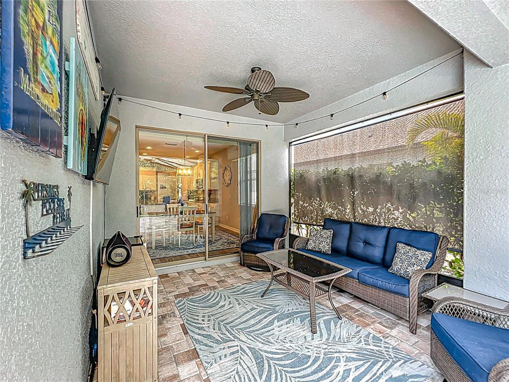 2676 Estuary Loop Oviedo, FL 32765 - Photo 70 of 92 a living room with furniture and a floor to ceiling window