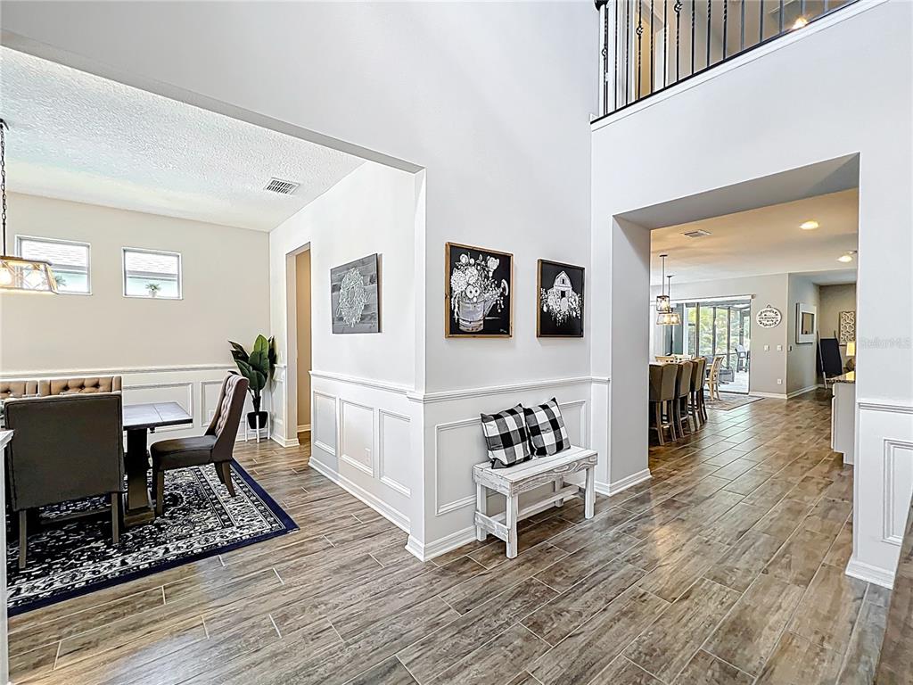 2676 Estuary Loop Oviedo, FL 32765 - Photo 10 of 92 a living room with furniture and wooden floor