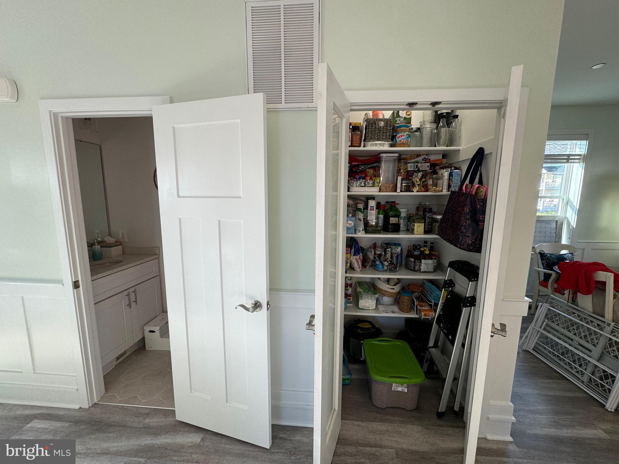 8315 Bayside Road Chesapeake Beach, MD 20732 - Photo 17 of 36 Motion-lit Pantry and half bath on the 2nd floor.