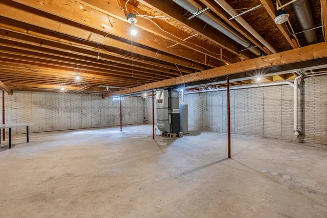 a view of empty room with wooden ceiling