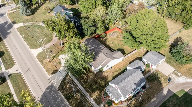 an aerial view of a house with a yard
