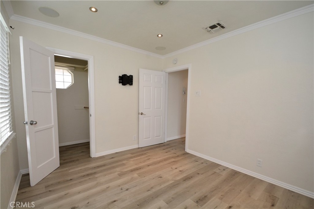 12301 Rives Avenue Downey, CA 90242 - Photo 12 of 20 a view of an empty room with wooden floor
