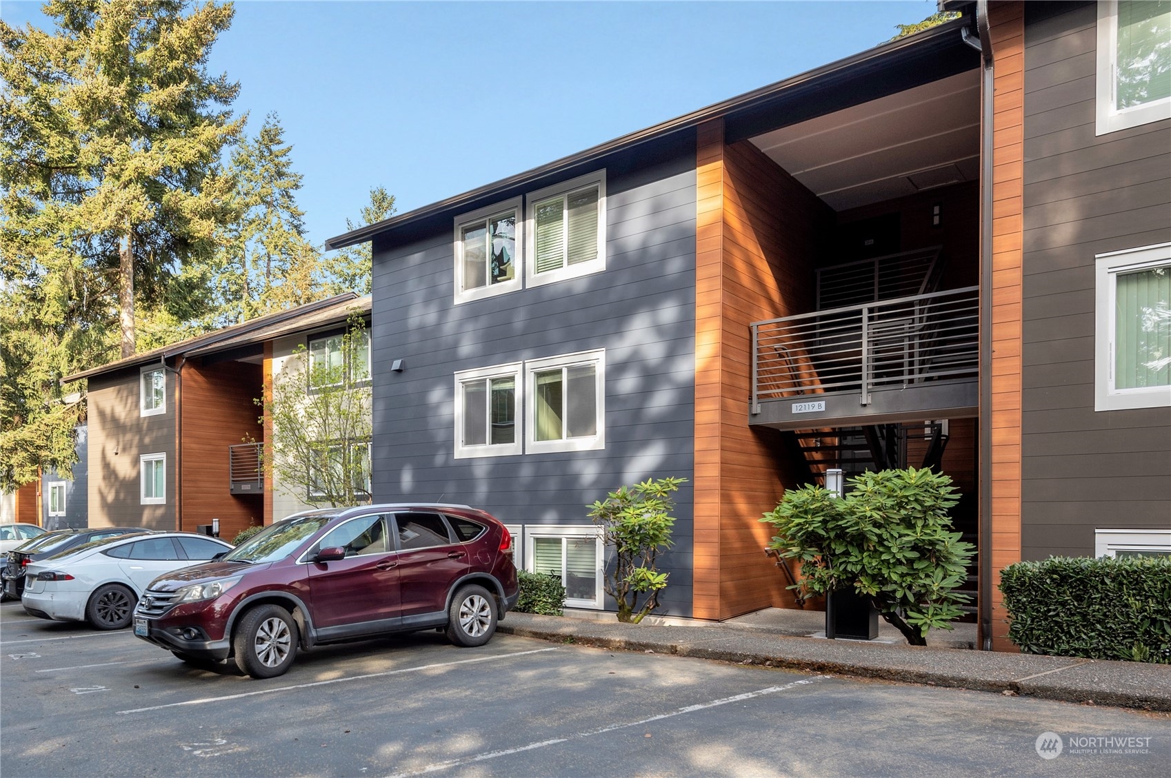 12119 Bel-Red Road, Unit B203 Bellevue, WA 98005 - Photo 1 of 15 a car parked in front of a house