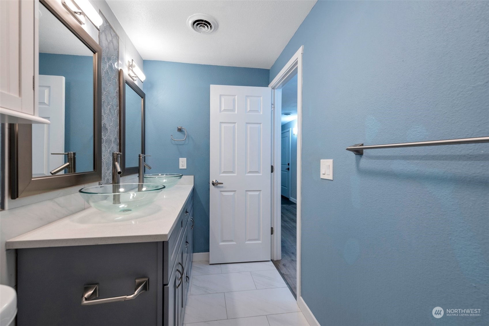 12119 Bel-Red Road, Unit B203 Bellevue, WA 98005 - Photo 11 of 15 a bathroom with a sink and a mirror