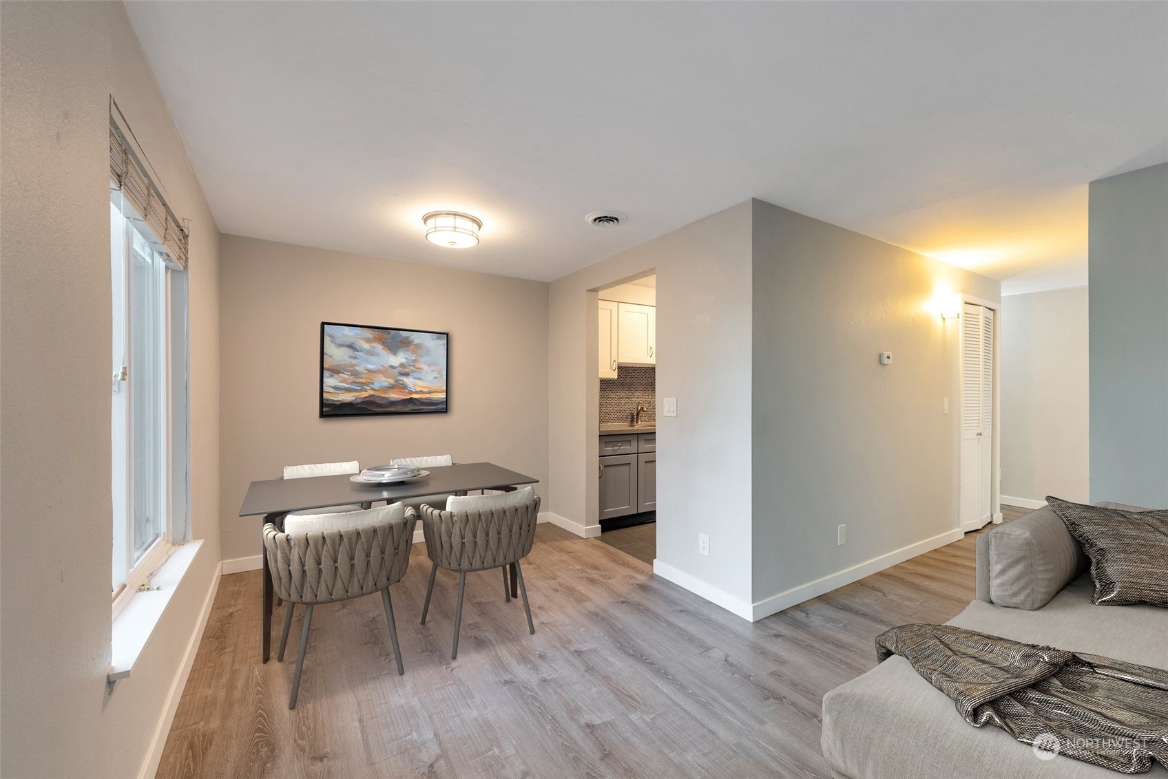 12119 Bel-Red Road, Unit B203 Bellevue, WA 98005 - Photo 5 of 15 a living room with furniture and a wooden floor