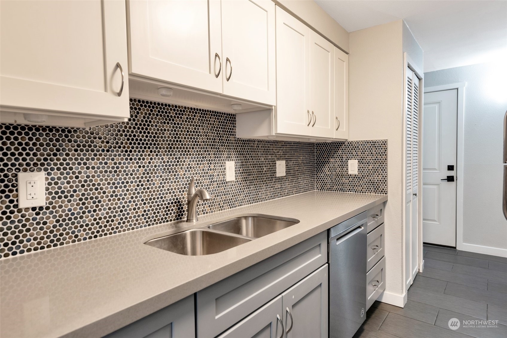 12119 Bel-Red Road, Unit B203 Bellevue, WA 98005 - Photo 6 of 15 a kitchen with a sink and cabinets