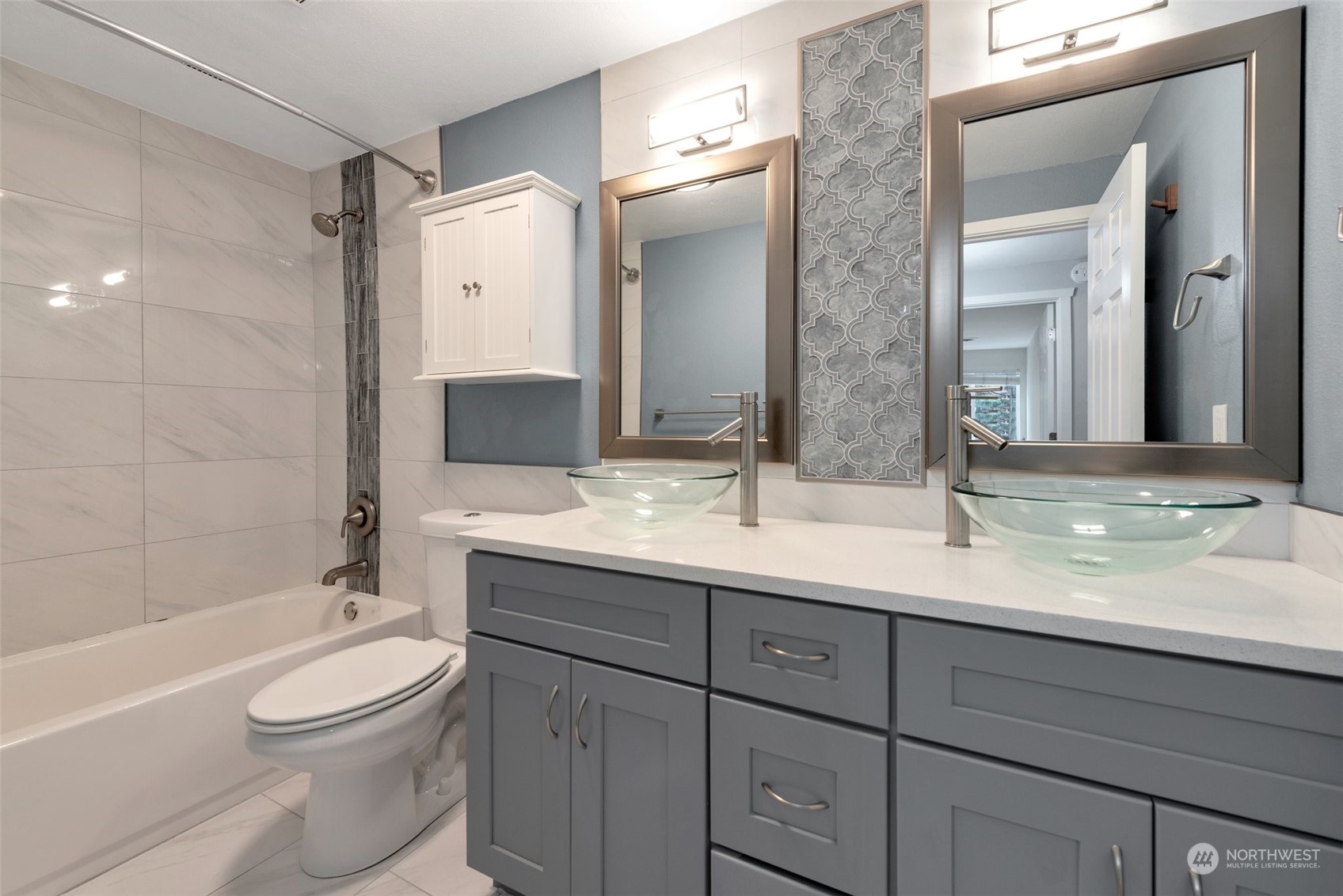 12119 Bel-Red Road, Unit B203 Bellevue, WA 98005 - Photo 10 of 15 a bathroom with a toilet a sink a tub and mirror