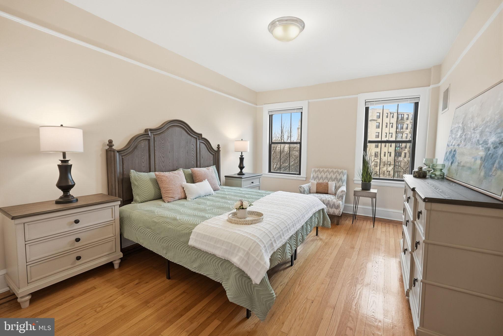 1613 Harvard Street Northwest, Unit 501 Washington, DC 20009 - Photo 12 of 25 Bright and inviting bedroom with city views.