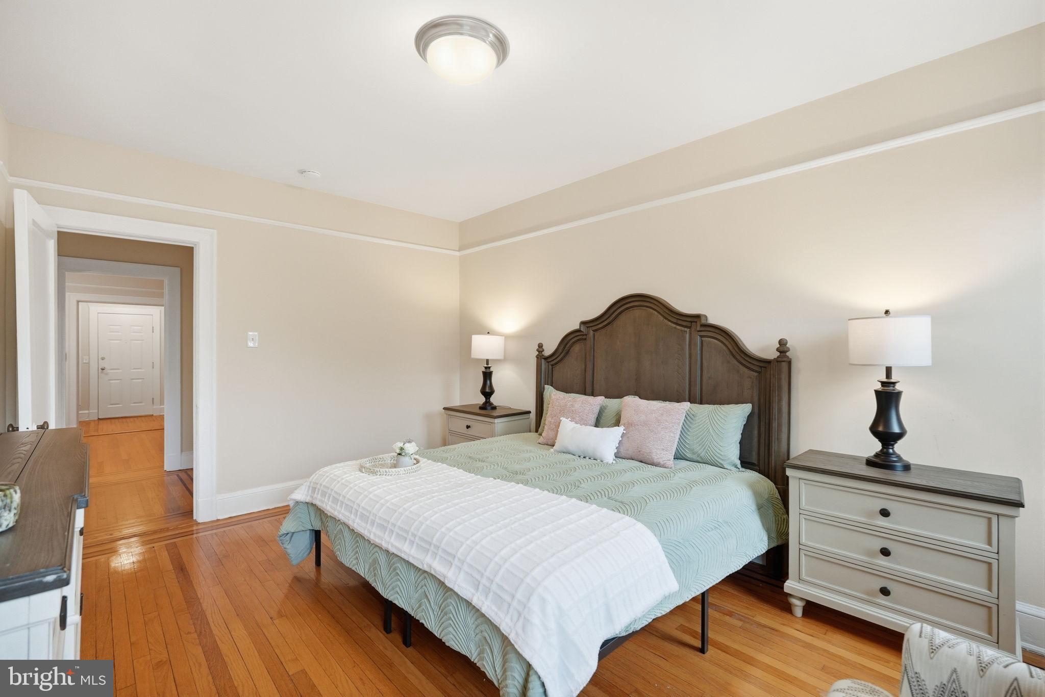 1613 Harvard Street Northwest, Unit 501 Washington, DC 20009 - Photo 13 of 25 Serene bedroom with elegant design elements.