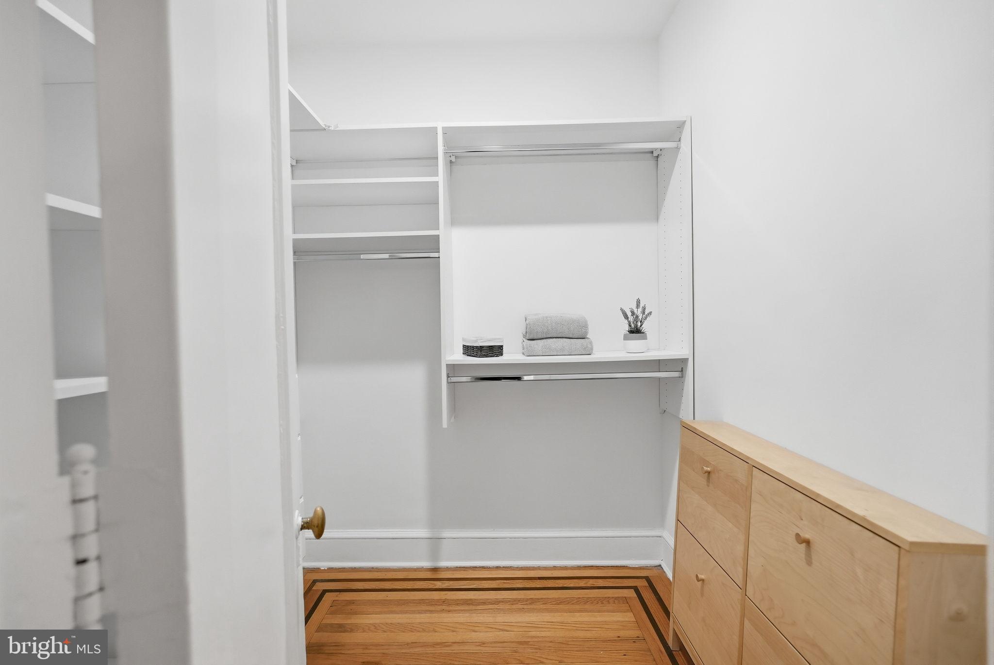 1613 Harvard Street Northwest, Unit 501 Washington, DC 20009 - Photo 15 of 25 Spacious, minimalist closet with natural light.