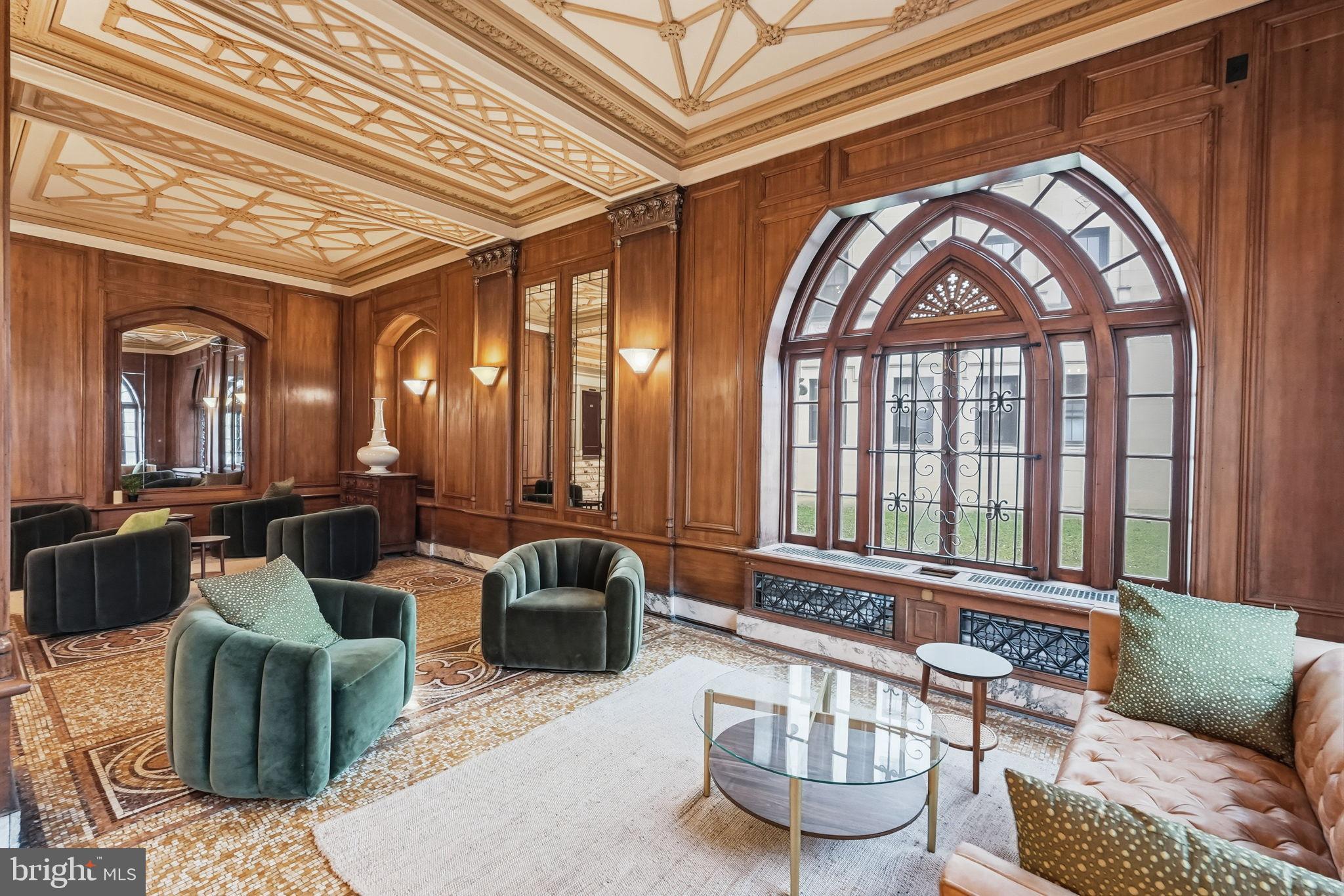1613 Harvard Street Northwest, Unit 501 Washington, DC 20009 - Photo 20 of 25 Elegant wood-paneled lounge with arched windows.