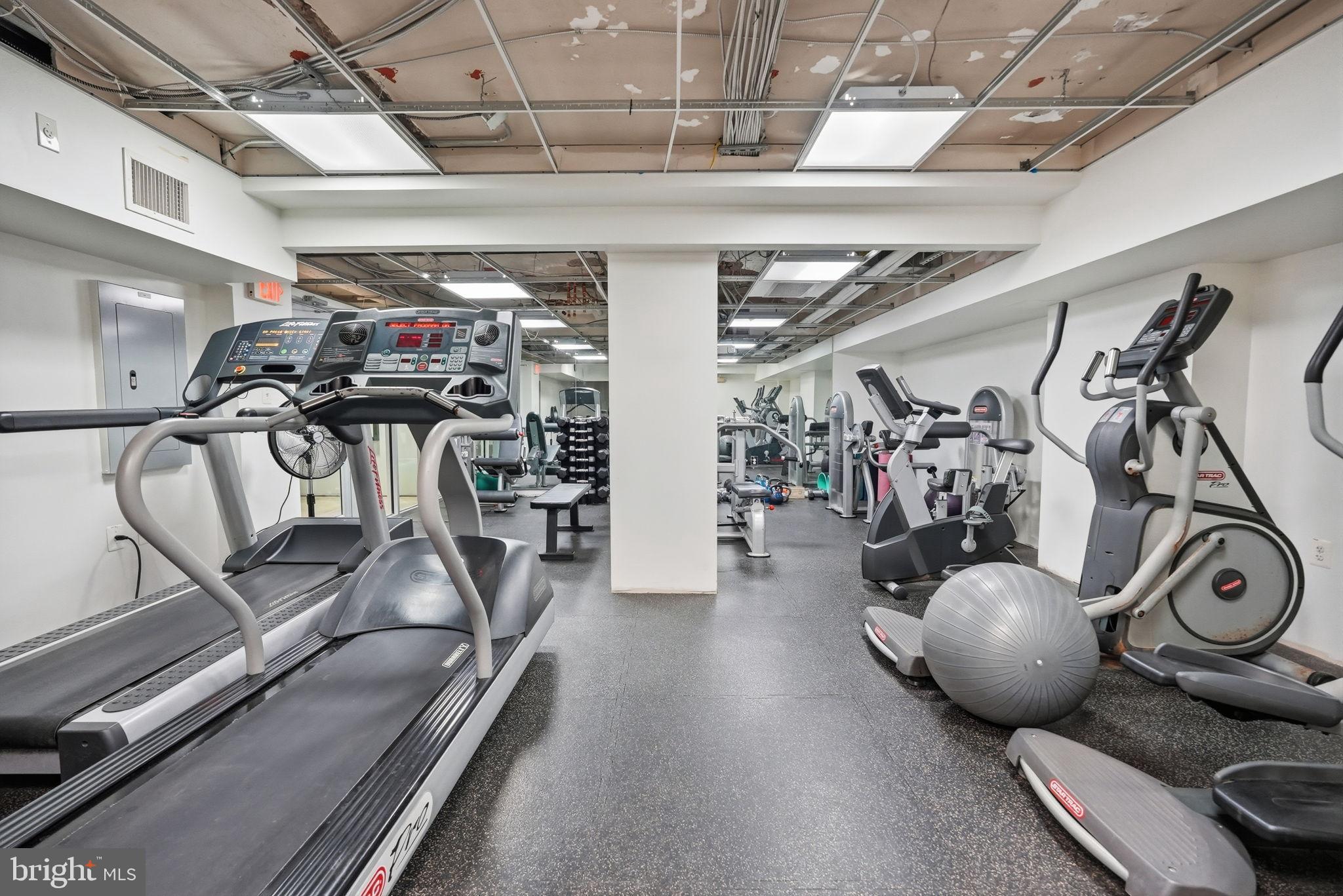 1613 Harvard Street Northwest, Unit 501 Washington, DC 20009 - Photo 22 of 25 Modern fitness center with diverse equipment.