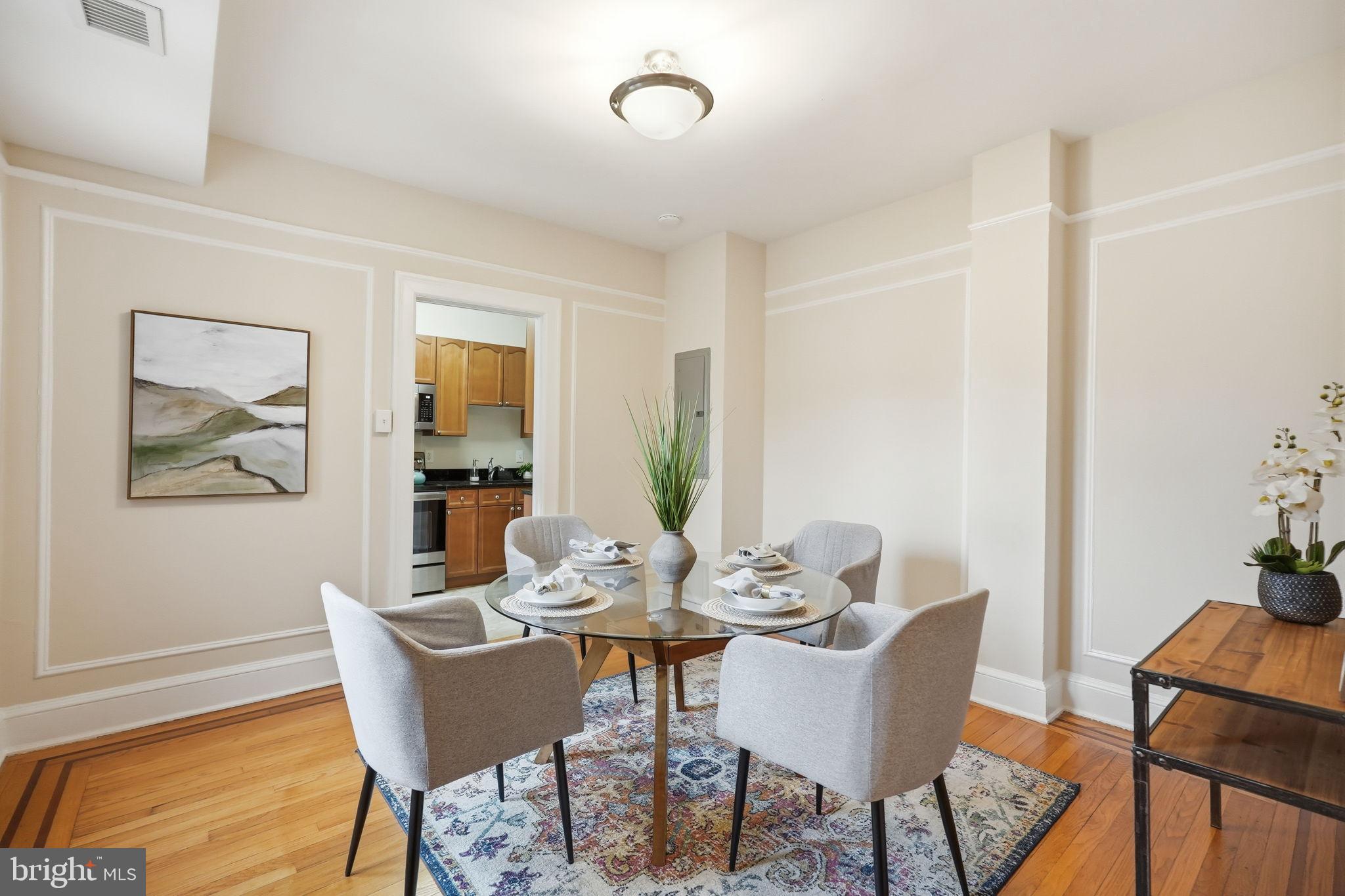 1613 Harvard Street Northwest, Unit 501 Washington, DC 20009 - Photo 6 of 25 Charming dining area with elegant details.