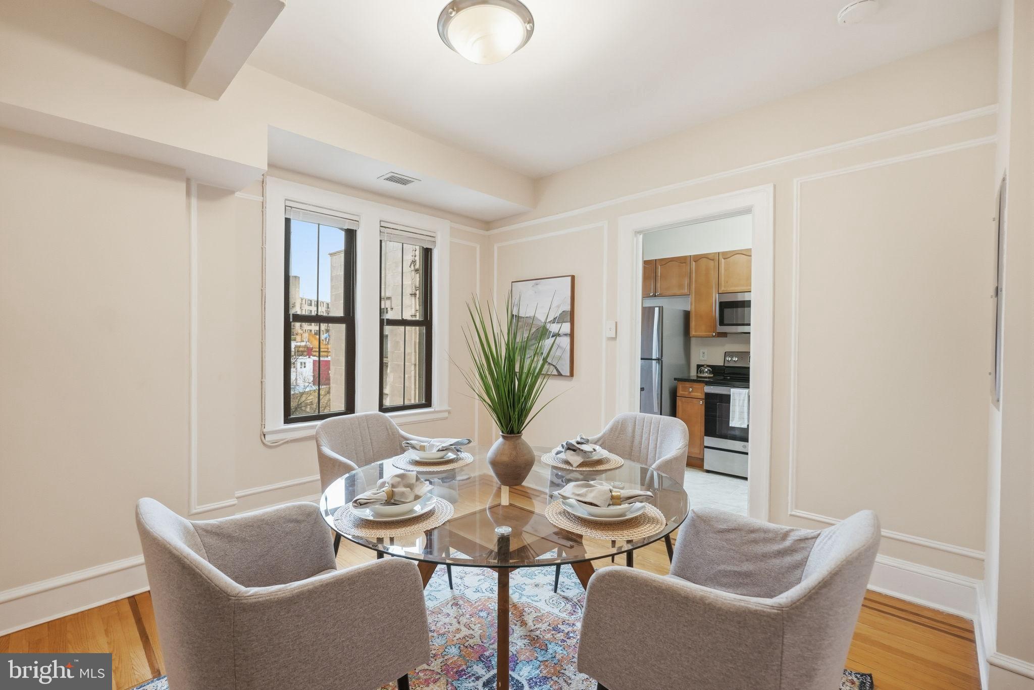 1613 Harvard Street Northwest, Unit 501 Washington, DC 20009 - Photo 7 of 25 Bright dining space with urban views.