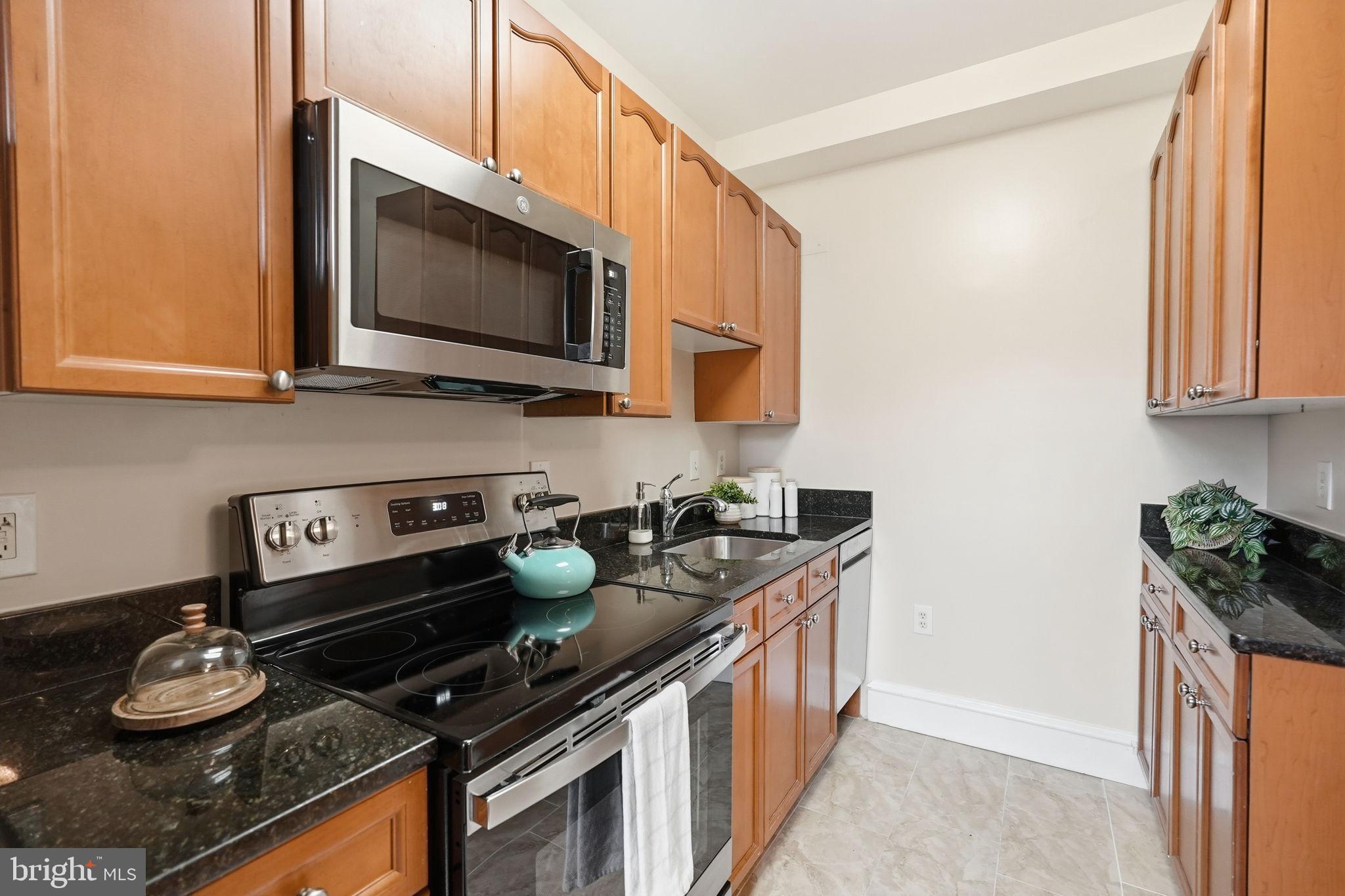 1613 Harvard Street Northwest, Unit 501 Washington, DC 20009 - Photo 9 of 25 Modern kitchen with sleek finishes.