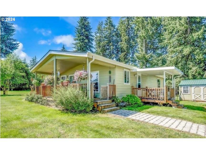 69911 Walker Road Rainier, OR 97048 - Photo 1 of 26 a view of a house with backyard