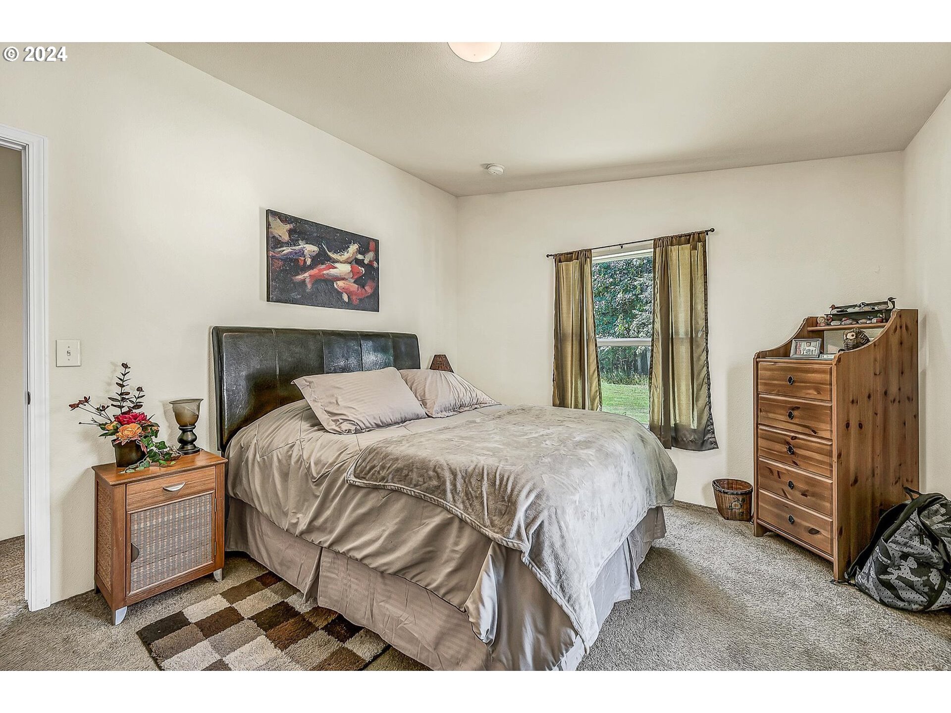 69911 Walker Road Rainier, OR 97048 - Photo 13 of 26 a bedroom with a bed and a closet