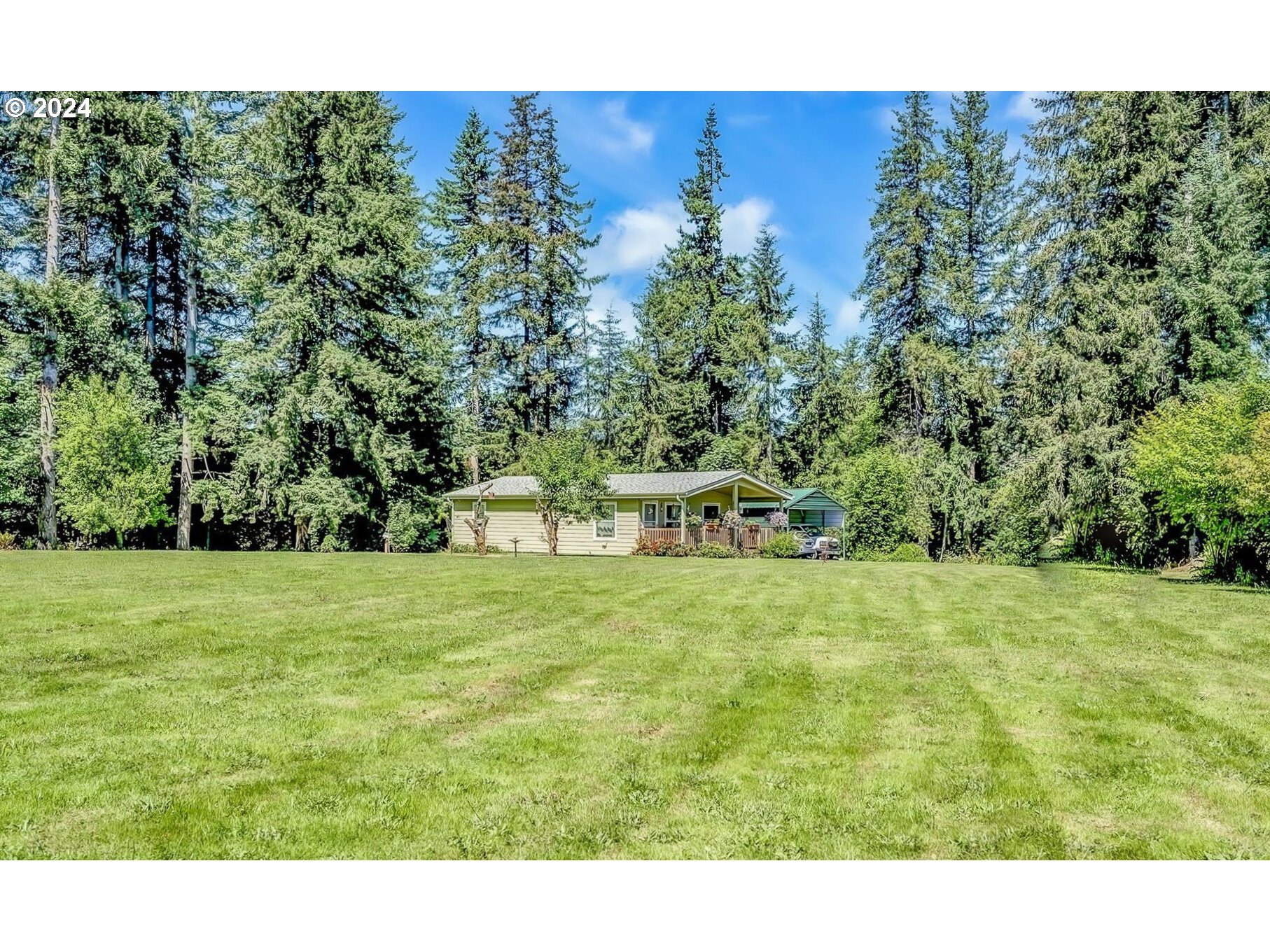 69911 Walker Road Rainier, OR 97048 - Photo 18 of 26 a view of a big yard with a house in the background