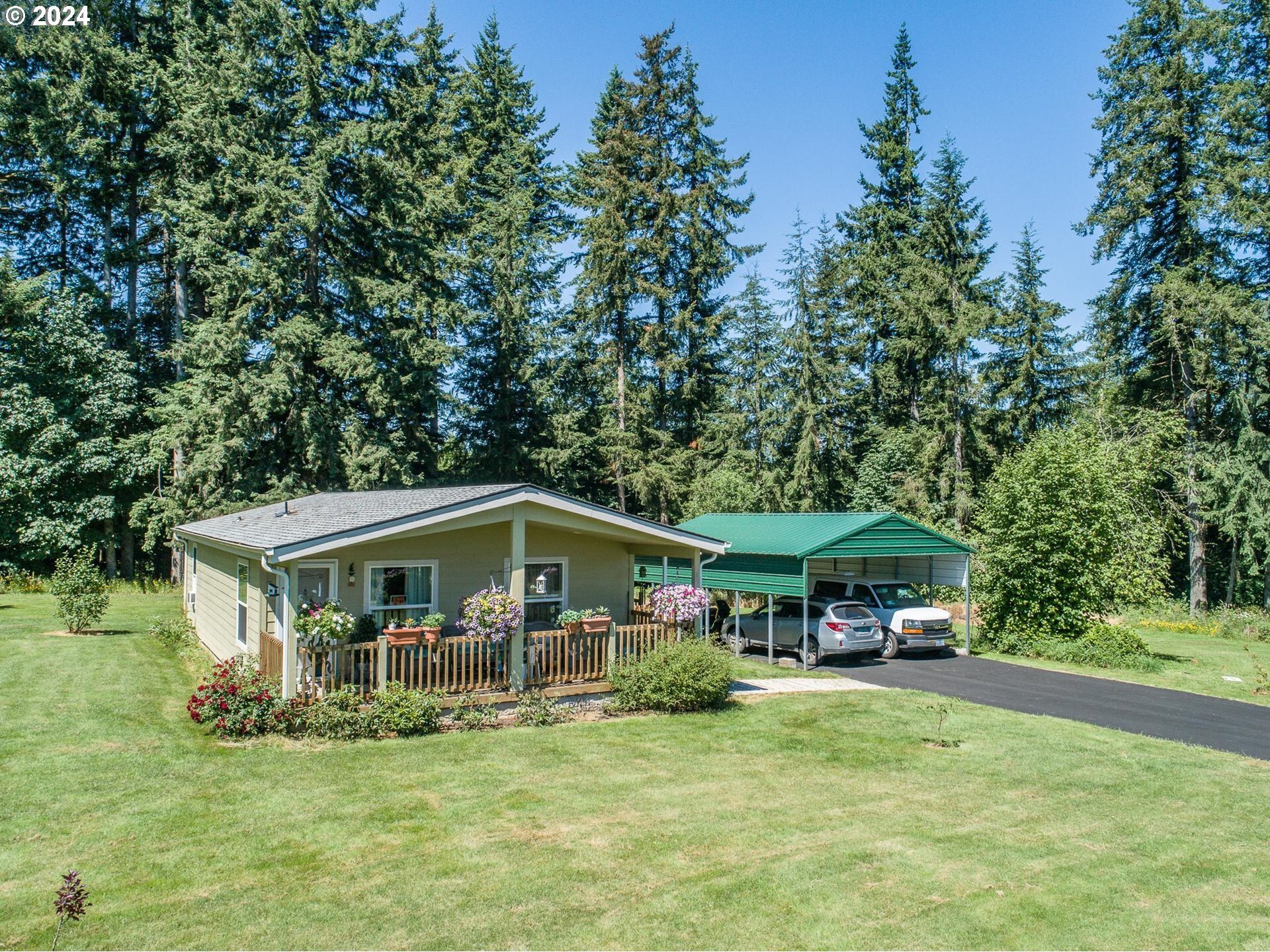 69911 Walker Road Rainier, OR 97048 - Photo 21 of 26 a front view of house with yard entertaining and outdoor seating