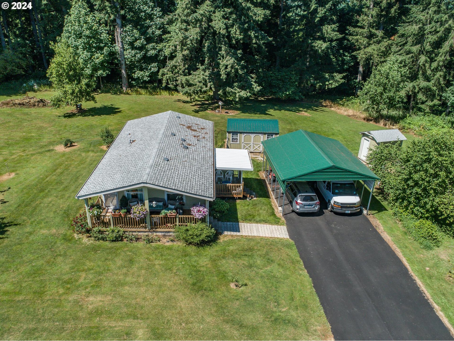 69911 Walker Road Rainier, OR 97048 - Photo 3 of 26 an aerial view of a house with garden space and a patio