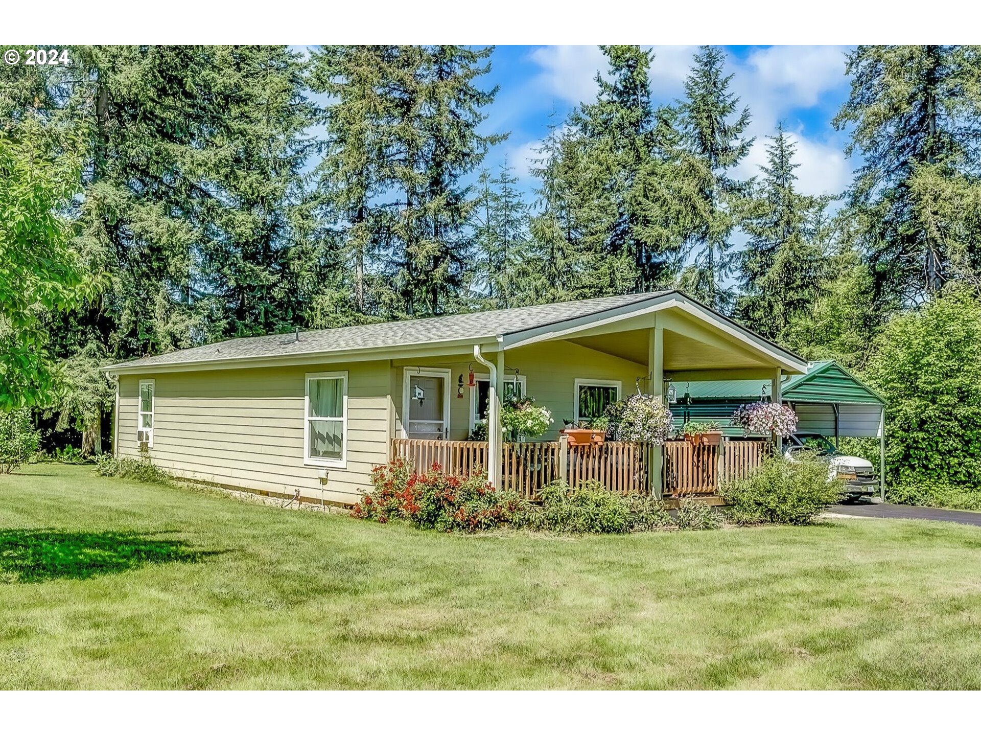 69911 Walker Road Rainier, OR 97048 - Photo 4 of 26 a view of a house with a backyard