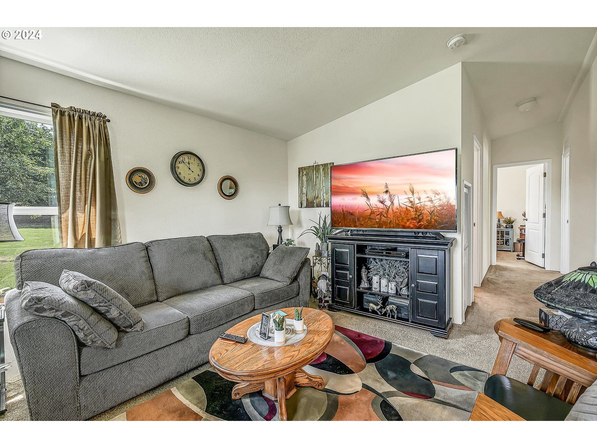 69911 Walker Road Rainier, OR 97048 - Photo 7 of 26 a living room with fireplace furniture and a flat screen tv