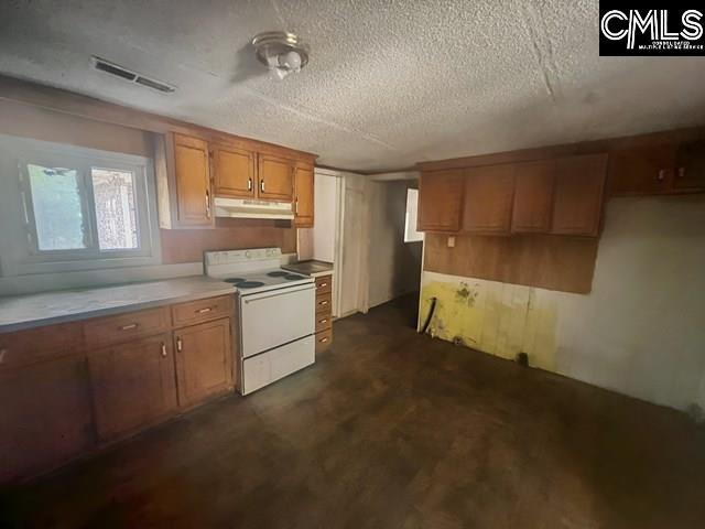 5545 Pisgah Road Rembert, SC 29128 - Photo 17 of 26 a kitchen with granite countertop white cabinets and white appliances