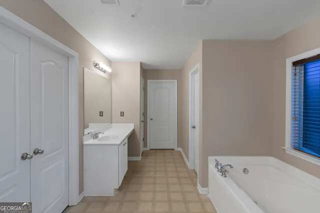 a bathroom with a bathtub sink and toilet