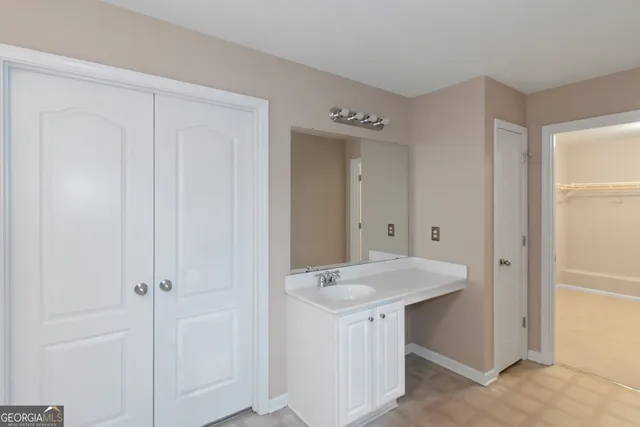 a bathroom with a sink and mirror
