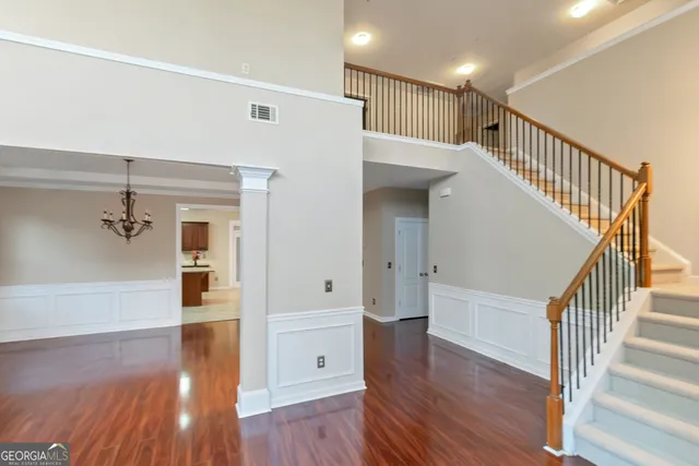 a view of entryway with wooden floor