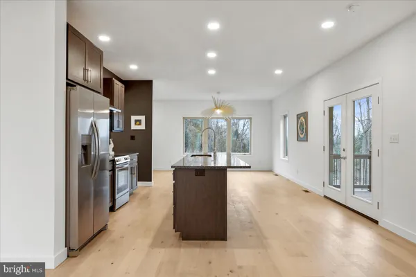 a kitchen with a sink and cabinets