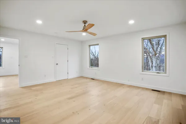 a bathroom with double sink and a mirror