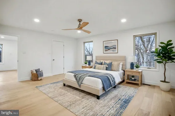 a bathroom with double sink and a mirror