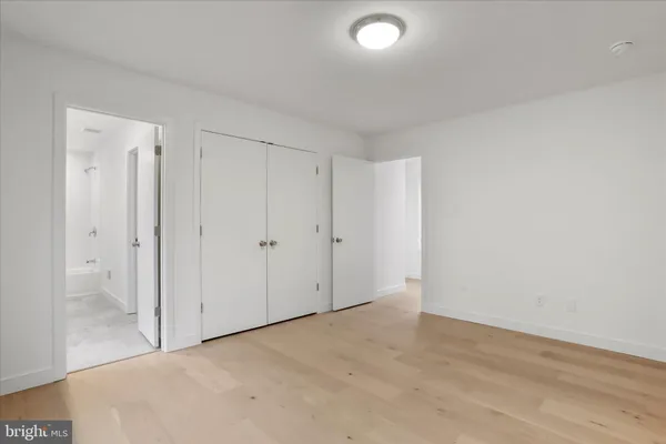 a spacious bathroom with a double vanity sink and a mirror