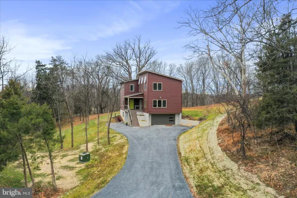 a view of a room with a wooden wall and door