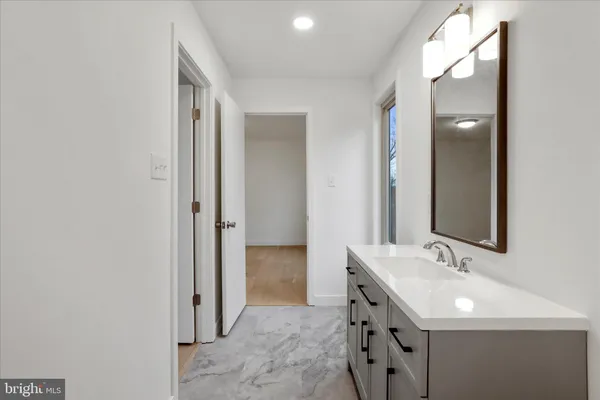 an empty room with a empty space and windows