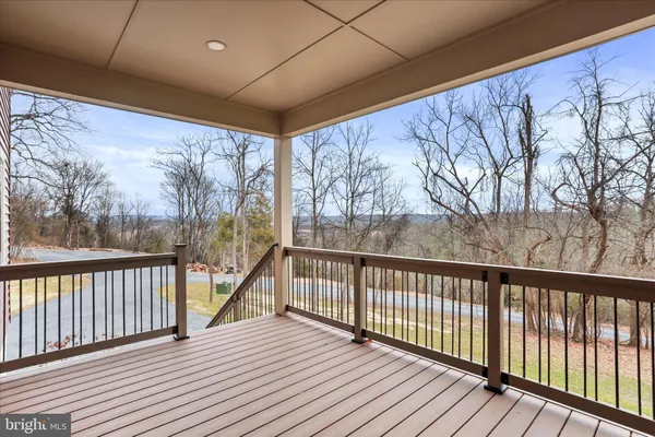 a kitchen with kitchen island granite countertop a sink stainless steel appliances and cabinets