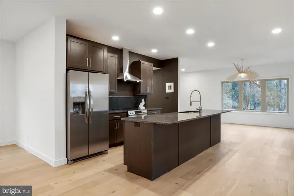 a kitchen with counter top space cabinets and sink