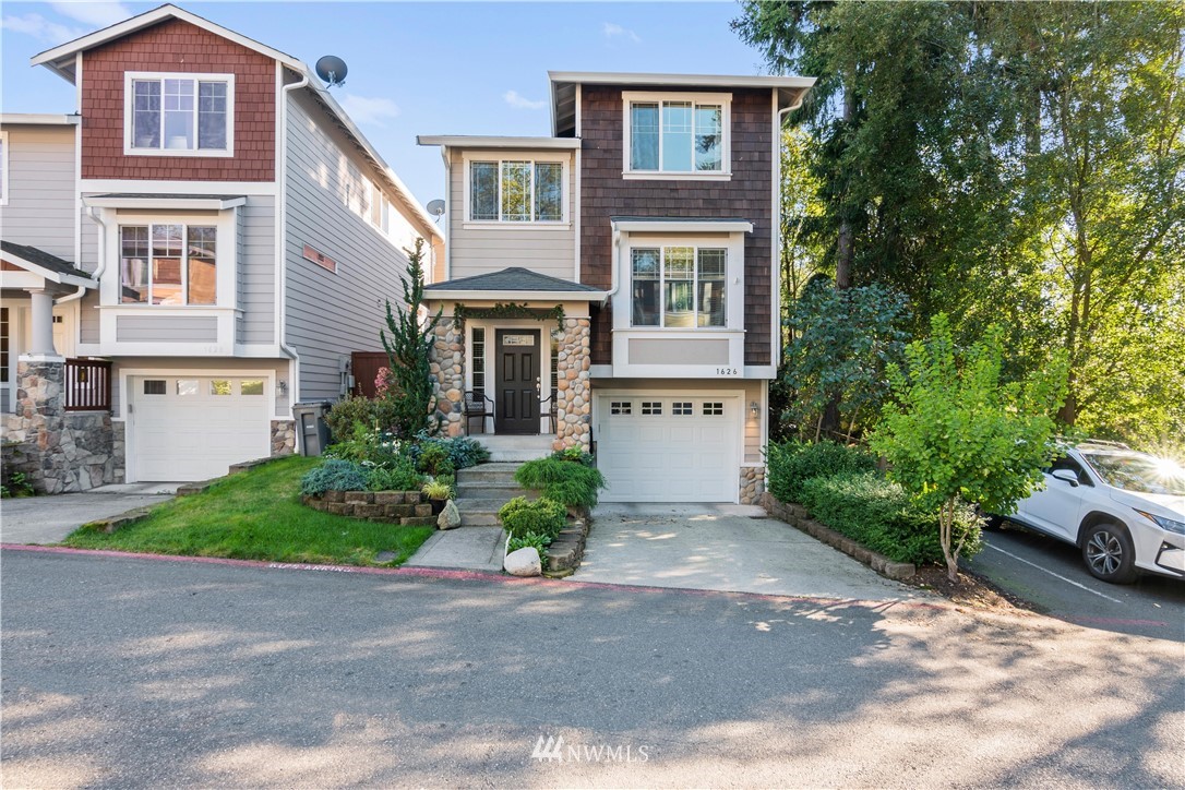 1626 93rd Place Southwest Everett, WA 98204 - Photo 1 of 25 a front view of a house with garden