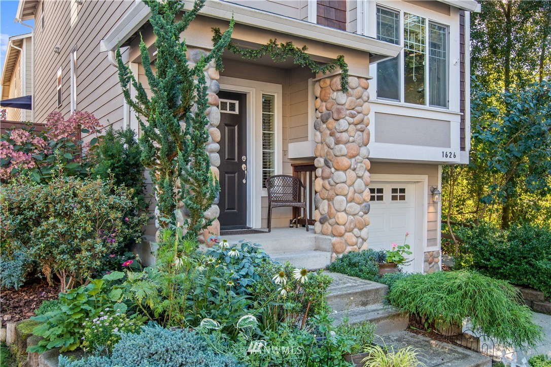 1626 93rd Place Southwest Everett, WA 98204 - Photo 2 of 25 a front view of a house with garden