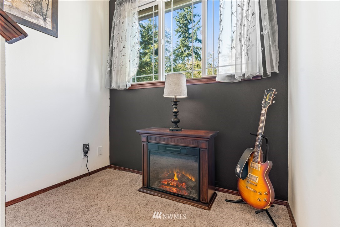 1626 93rd Place Southwest Everett, WA 98204 - Photo 11 of 25 a living room with furniture and a fireplace
