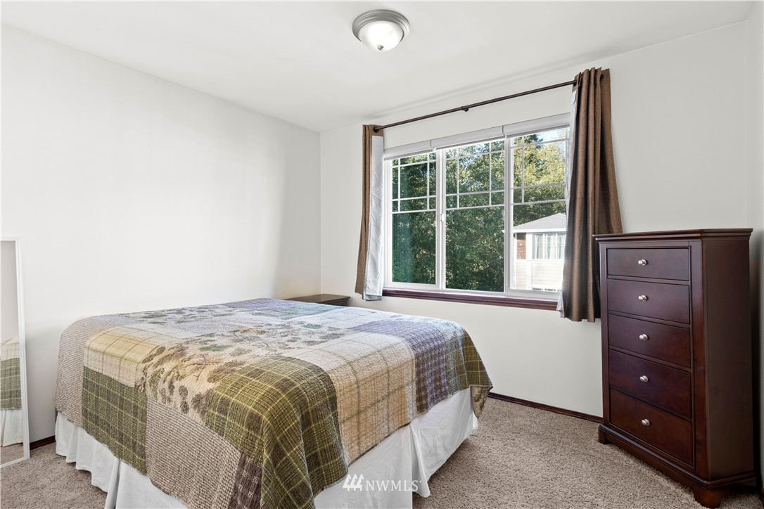 1626 93rd Place Southwest Everett, WA 98204 - Photo 13 of 25 a bedroom with a bed and a window