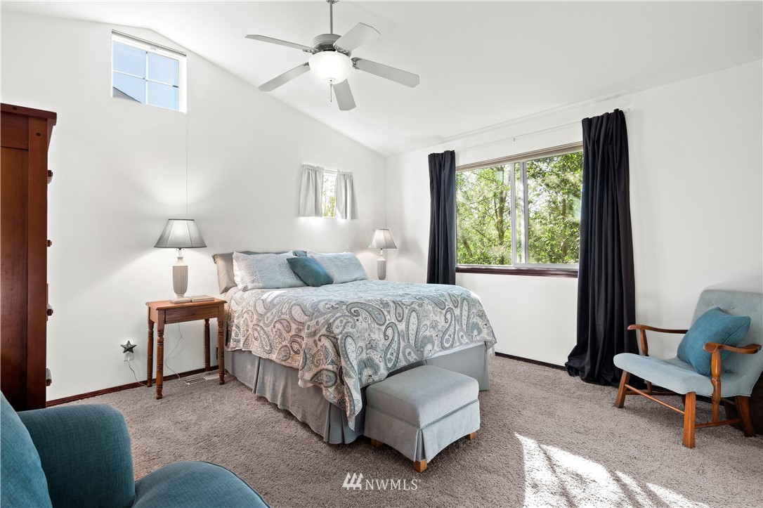 1626 93rd Place Southwest Everett, WA 98204 - Photo 17 of 25 a bedroom with a bed a couch and a window