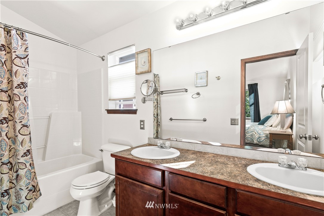 1626 93rd Place Southwest Everett, WA 98204 - Photo 19 of 25 a bathroom with a granite countertop sink toilet and shower
