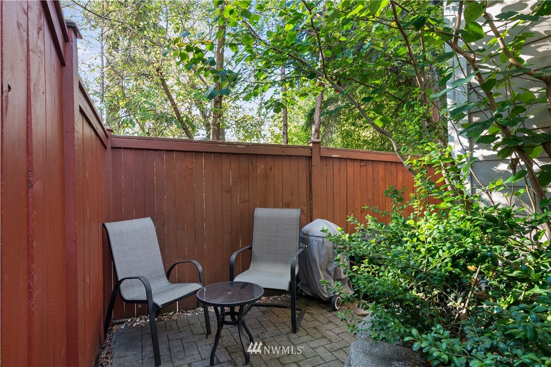 1626 93rd Place Southwest Everett, WA 98204 - Photo 22 of 25 a backyard of a house with table and chairs