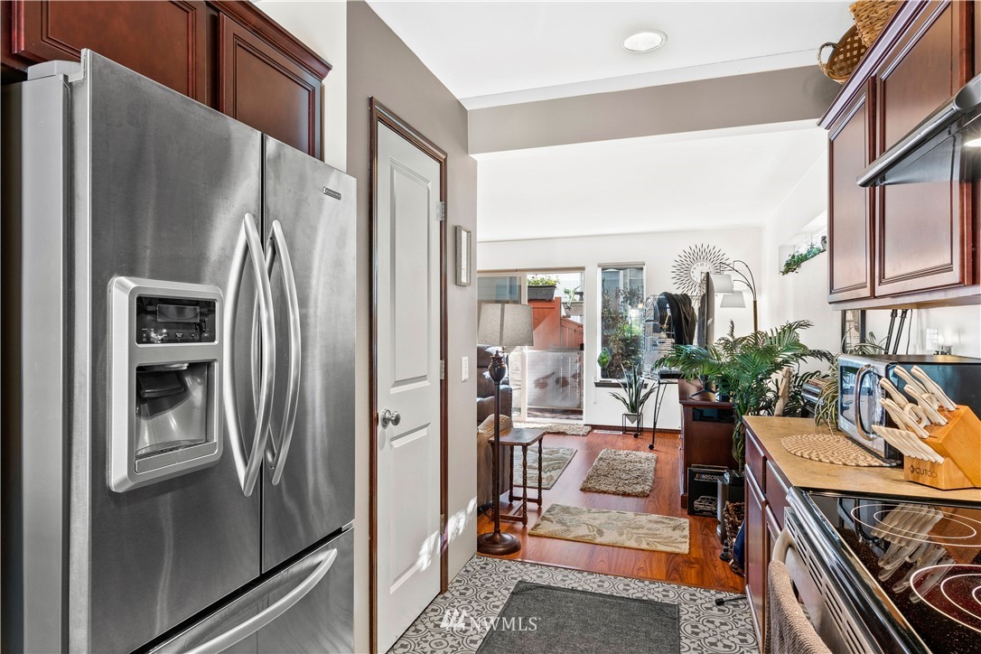1626 93rd Place Southwest Everett, WA 98204 - Photo 7 of 25 a view of a kitchen with furniture and a refrigerator